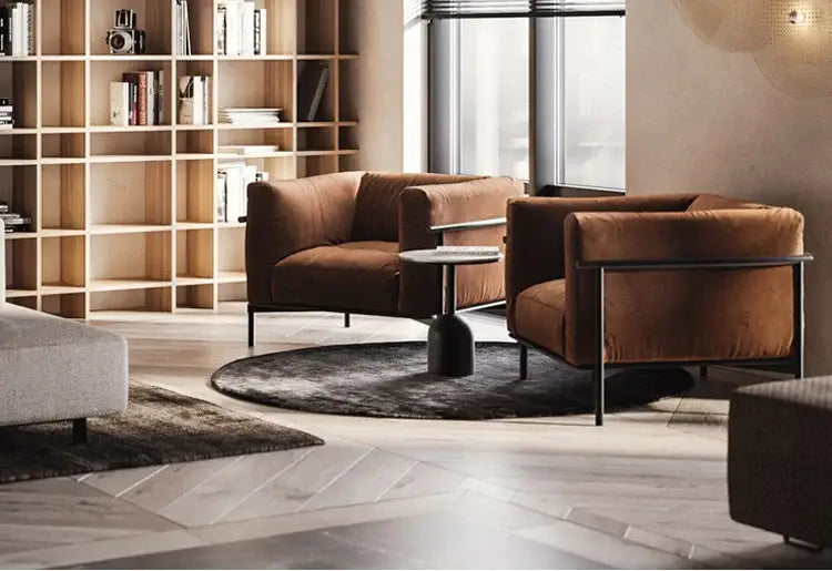 Gold Black Minimalist Chandelier in a modern living room with brown leather lounge chairs on Tampa Home & Garden Store