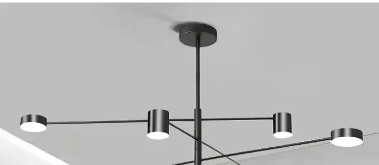 Gold Black Minimalist Chandelier with black metal arms and white cylindrical light heads on Tampa Home & Garden Store