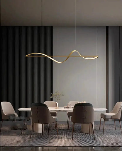 Chandelier Decorbites modern gold curved LED pendant over round dining table with beige chairs on Tampa Home & Garden Store