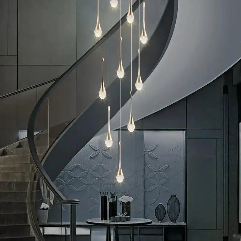 Modern gold LED crystal chandelier with cascading teardrop pendants for dining room on Tampa Home & Garden Store