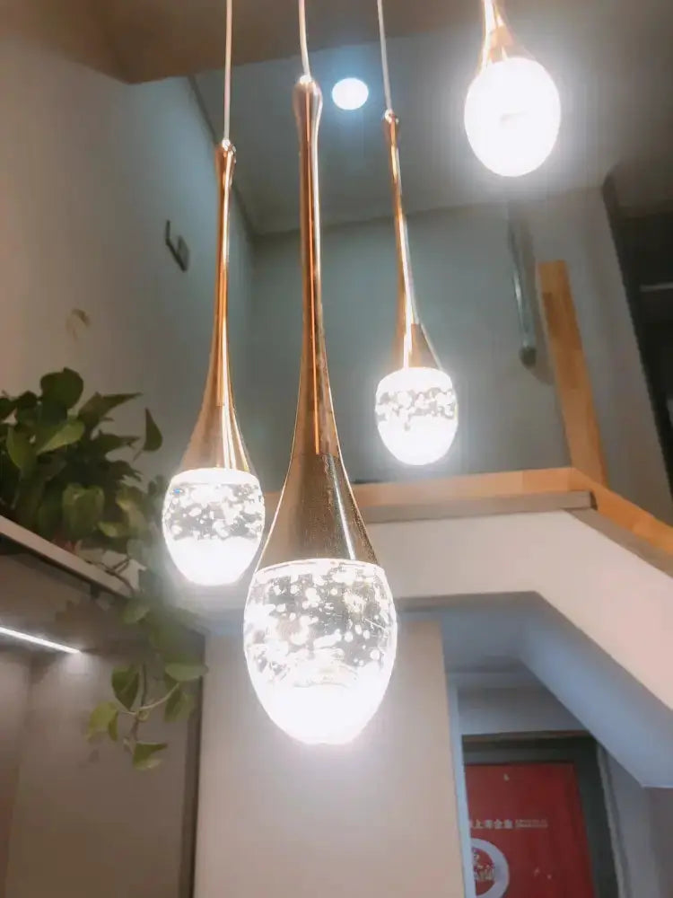 Chandelier four-pendant gold LED crystal cascading pendant lights by Decorbites for dining room on Tampa Home & Garden Store