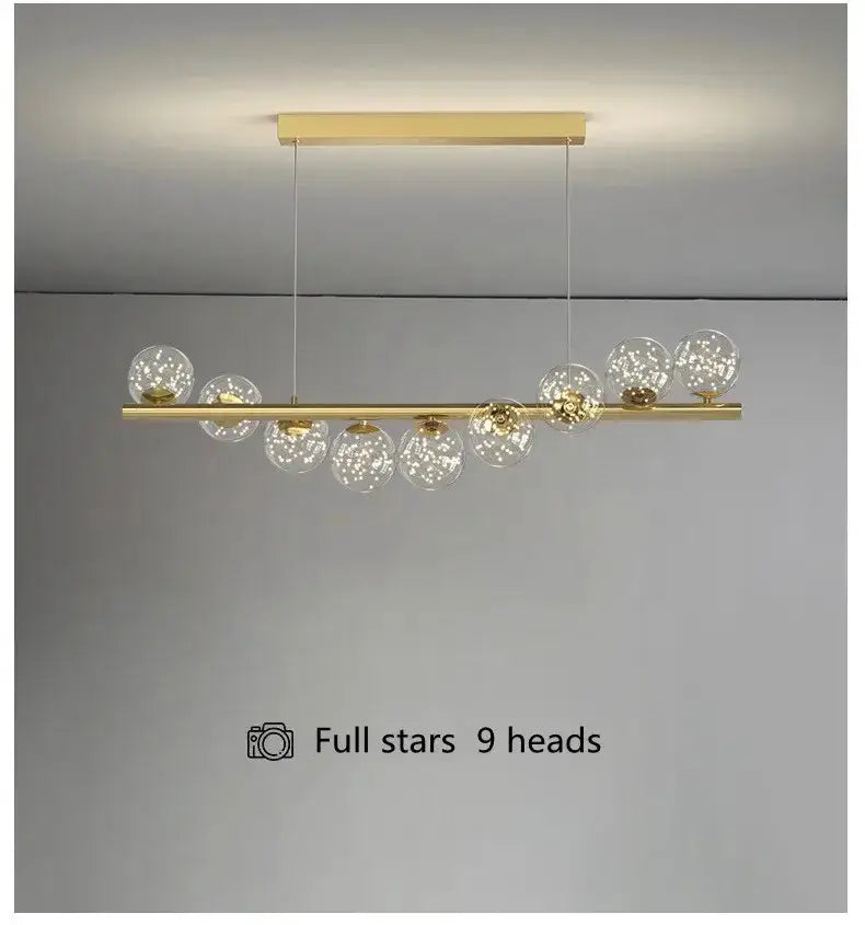 Modern gold linear LED glass chandelier with 9 clear globe pendants for dining room on Tampa Home & Garden Store
