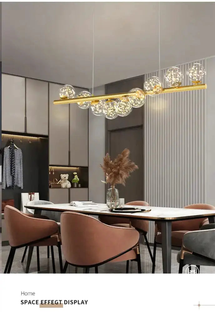 Chandelier Decorbites modern gold linear LED glass globe pendant light over a dining table on Tampa Home & Garden Store