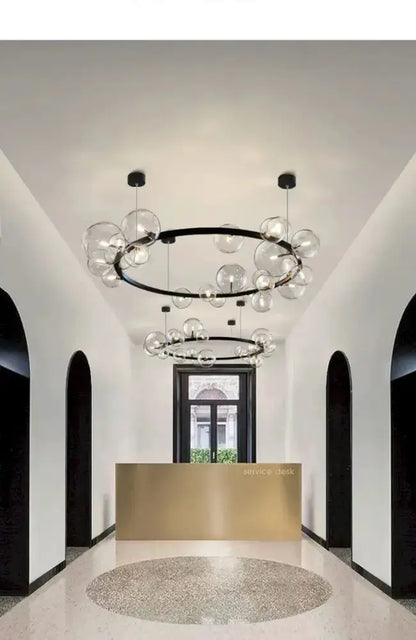 Chandelier Decorbites modern black circular ring LED with clear glass bubble globes on Tampa Home & Garden Store