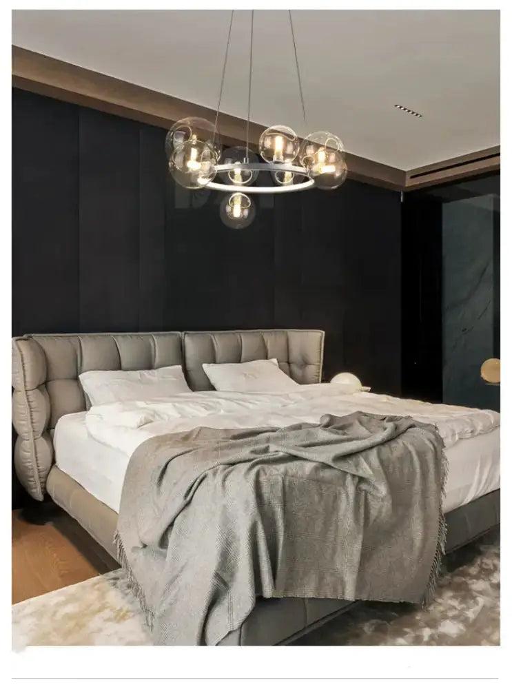 Chandelier Decorbites modern black clear glass bubble LED chandelier over bed in bedroom on Tampa Home & Garden Store