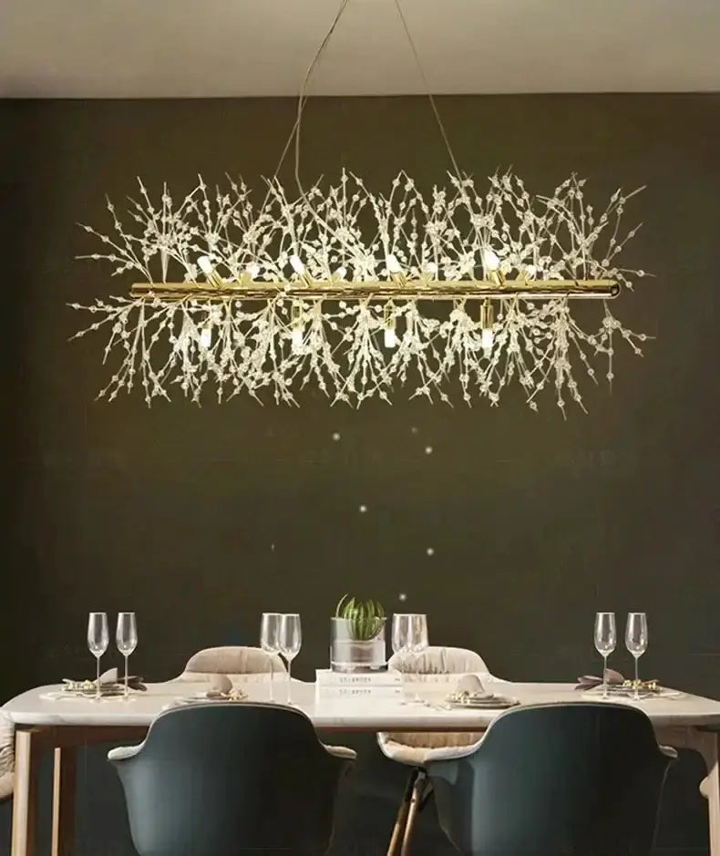 Chandelier Decorbites gold branch LED pendant with crystal branches over a dining table on Tampa Home & Garden Store