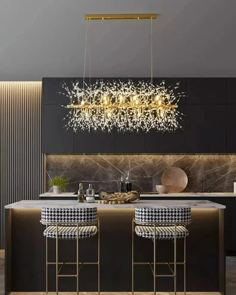 Pendant chandelier Modern gold branch LED lights over a marble island and two stools on Tampa Home & Garden Store
