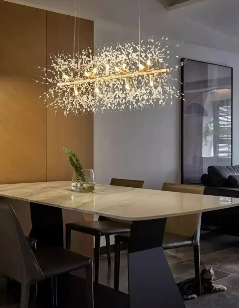 Gold branch LED pendant chandelier by Decorbites with crystal accents over a marble table on Tampa Home & Garden Store