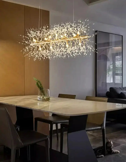 Gold branch LED pendant chandelier by Decorbites with crystal accents over a marble table on Tampa Home & Garden Store