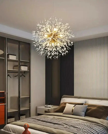 Modern gold branch LED pendant chandelier with crystal droplets by Decorbites in a chic bedroom on Tampa Home & Garden Store