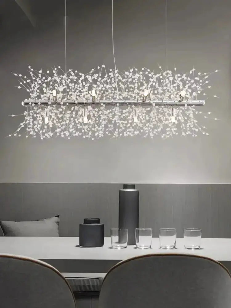 Chandelier Decorbites modern gold branch LED pendant with crystal droplets over dining table on Tampa Home & Garden Store