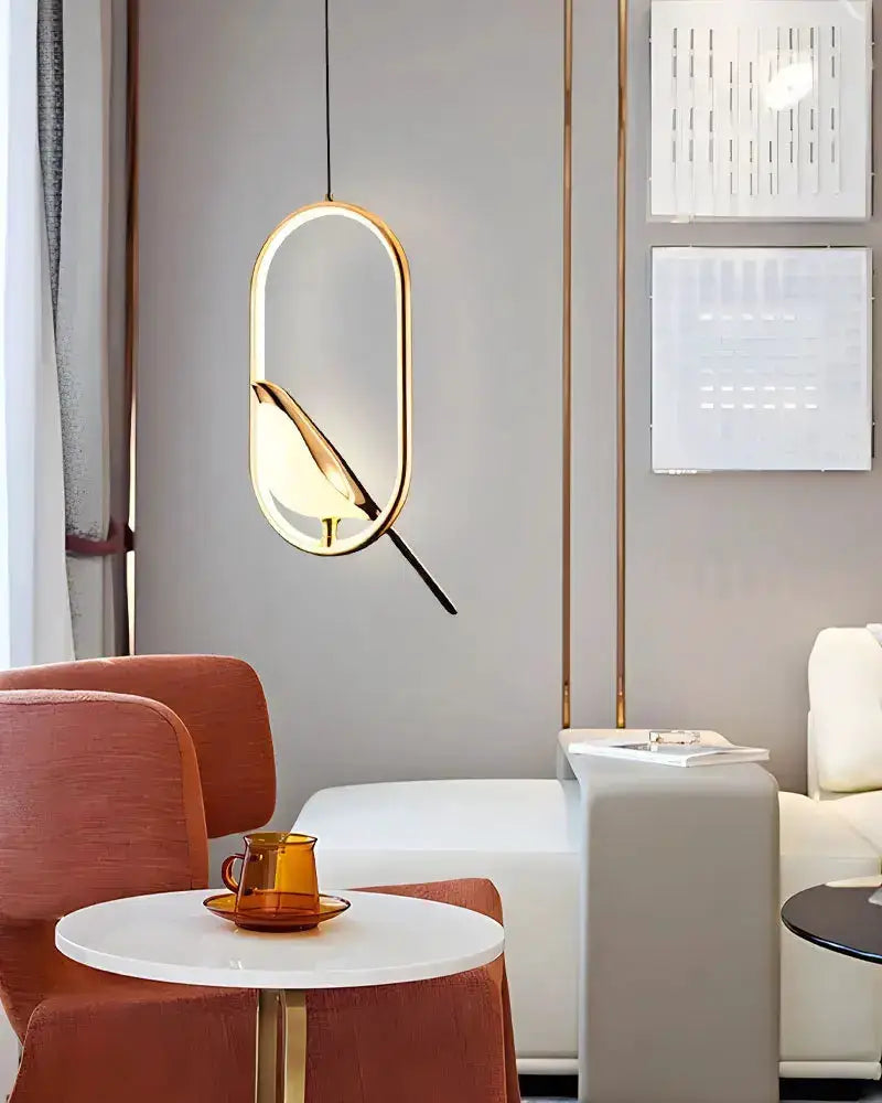 Decorbites gold magpie bird LED pendant light with geometric oval frame for dining room on Tampa Home & Garden Store