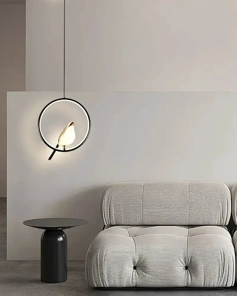 Modern gold magpie bird LED pendant light by Decorbites with circular geometric frame on Tampa Home & Garden Store