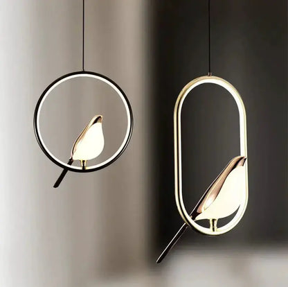 Modern gold magpie bird LED pendant light pair with circular ring and oval frame on Tampa Home & Garden Store