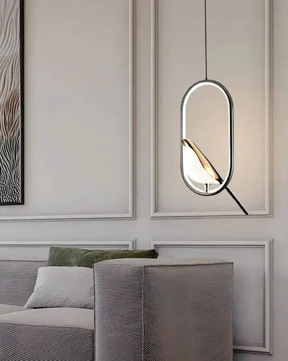 Modern gold magpie bird LED pendant light with oval geometric frame for dining room by Decorbites on Tampa Home & Garden Store