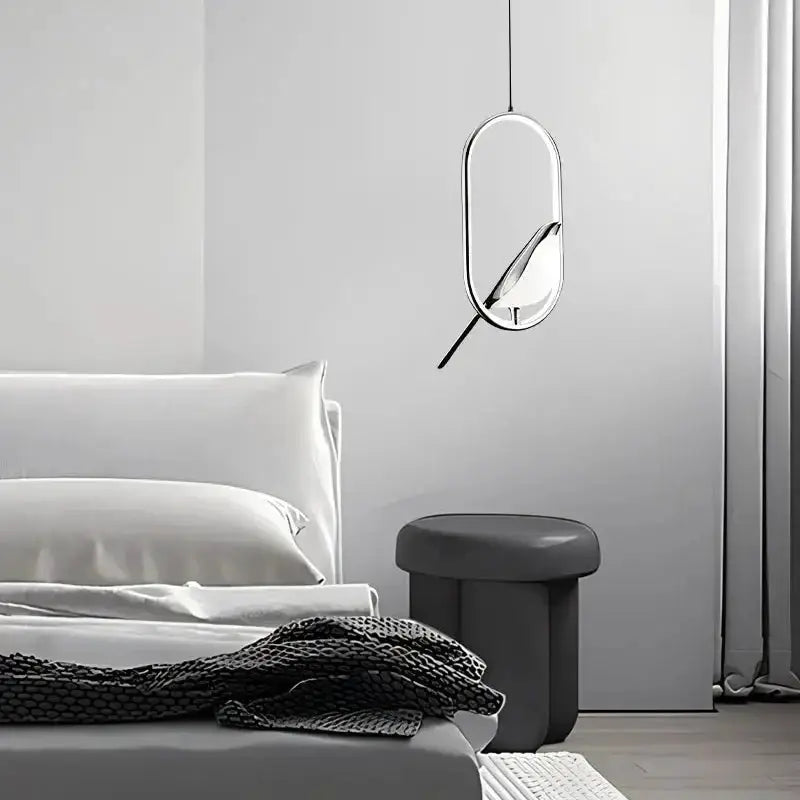 Modern gold magpie bird LED pendant light by Decorbites in a geometric oval frame on Tampa Home & Garden Store