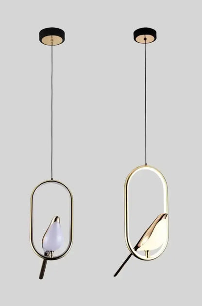Two gold oval-frame LED pendant lights with black cords on Tampa Home & Garden Store