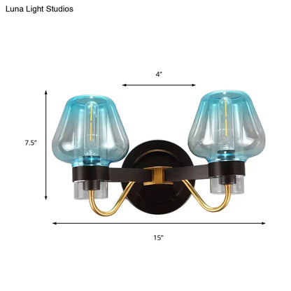 Blue glass mushroom sconce by Decorbites, two-light wall fixture with brass arms on Tampa Home & Garden Store