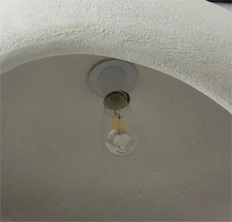 Modern gray and yellow dome pendant light with exposed clear glass bulb and warm LED filaments on Tampa Home & Garden Store