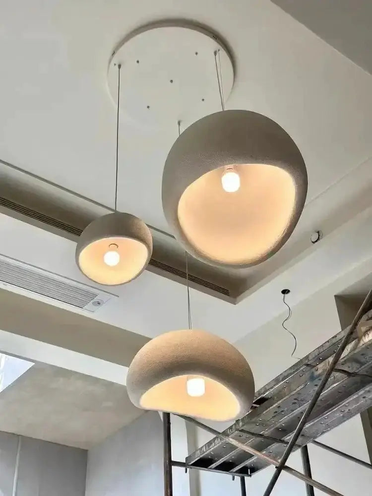 Modern gray dome pendant light trio by Decorbites with warm yellow interiors on Tampa Home & Garden Store