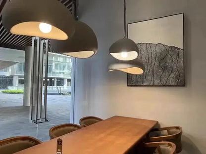 Decorbites gray and yellow dome pendant lights (set of 3) over a wooden dining table on Tampa Home & Garden Store