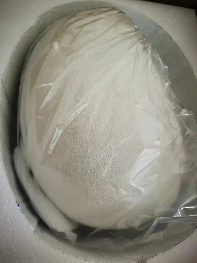 Gray dome pendant light wrapped in plastic inside foam packaging on Tampa Home & Garden Store