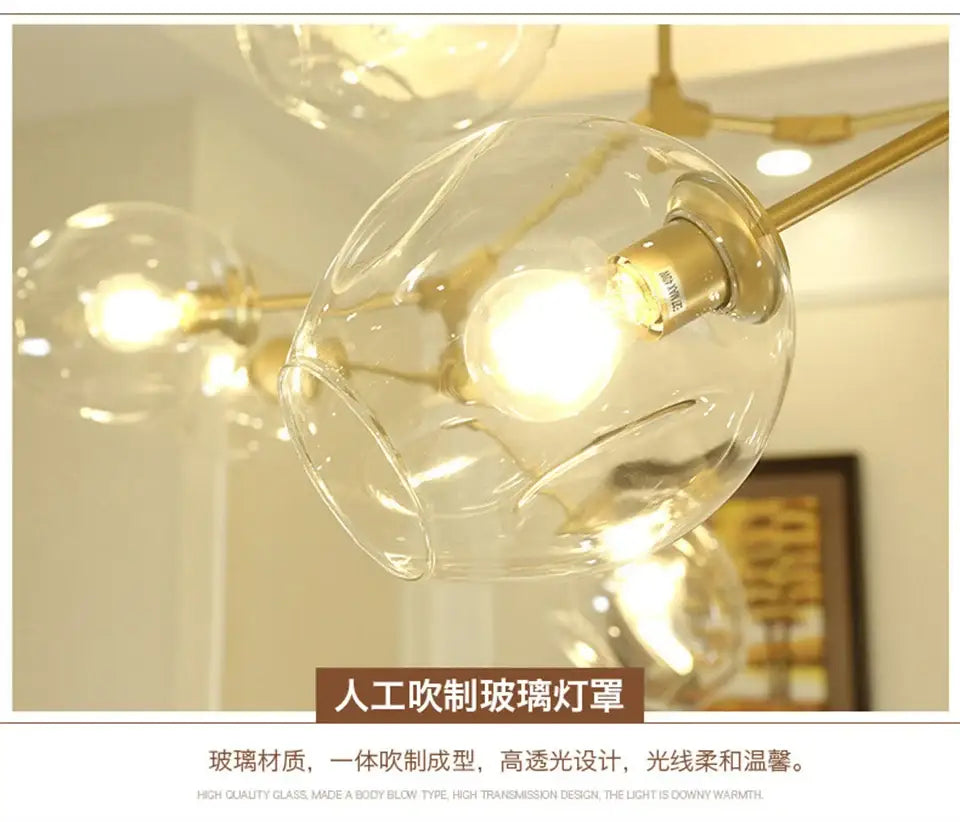 Gradient Blue Glass Chandelier by Decorbites with clear glass globes on a gold frame on Tampa Home & Garden Store