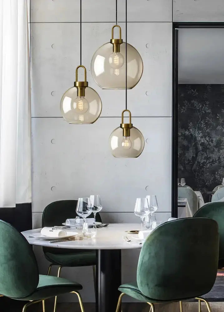 Pendant light set by Decorbites, smoked glass with brass hardware, 3-globe design on Tampa Home & Garden Store