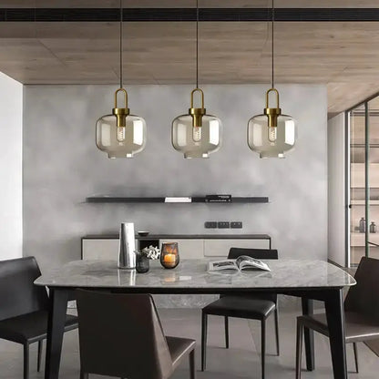 Modern smoked glass and brass pendant light set by Decorbites for kitchen dining, three pendants on Tampa Home & Garden Store