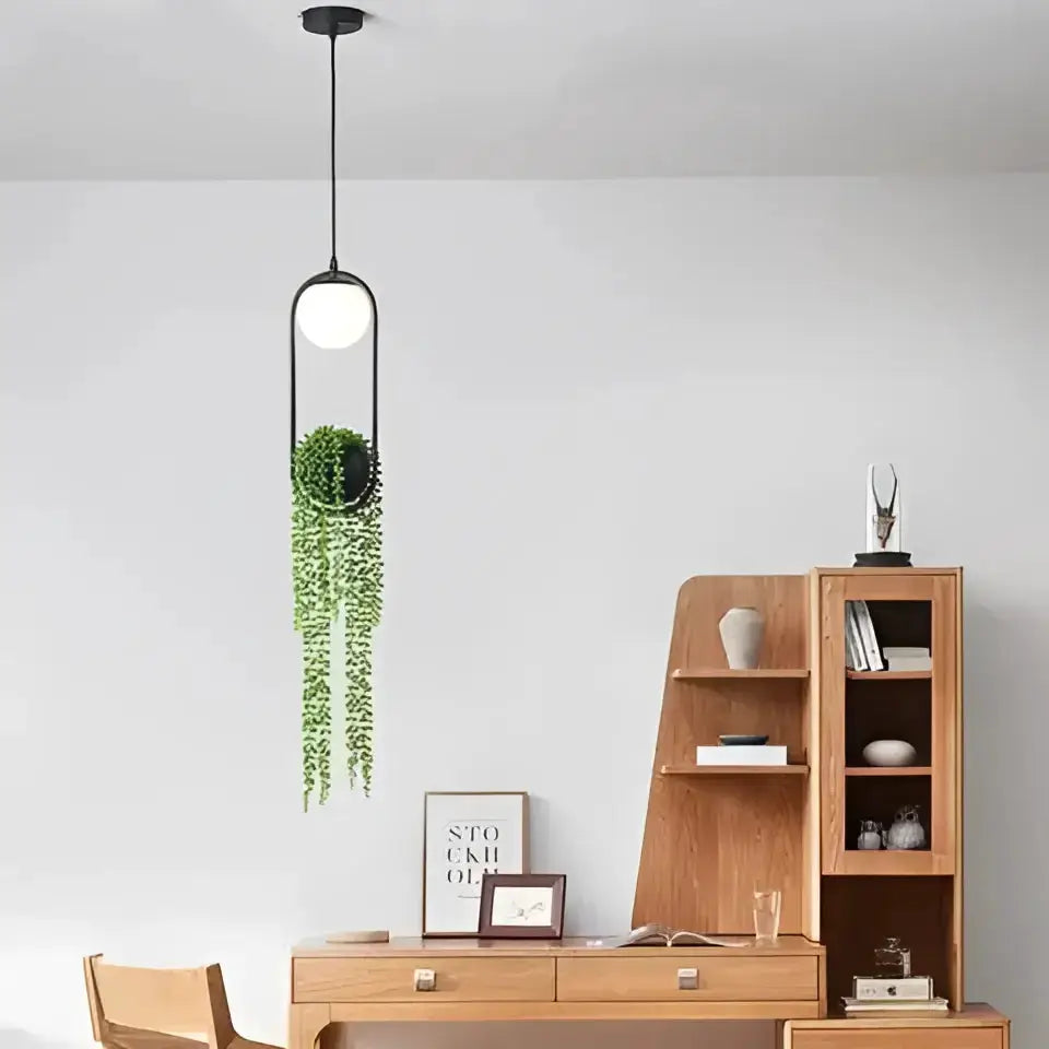 Decorbites planter pendant light with black frame, white globe, and trailing greenery on Tampa Home & Garden Store