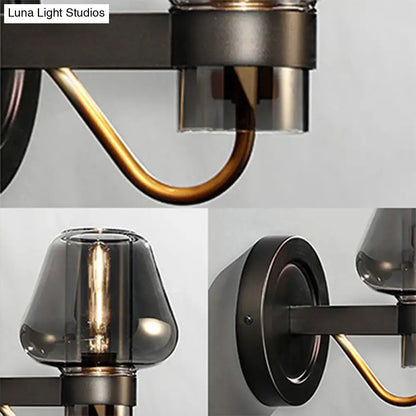 Decorbites black brass mushroom sconce with curved brass arm and smoky glass shades wall-mount on Tampa Home & Garden Store