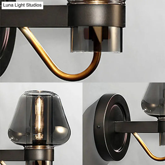 Decorbites black brass mushroom sconce with curved brass arm and smoky glass shades wall-mount on Tampa Home & Garden Store