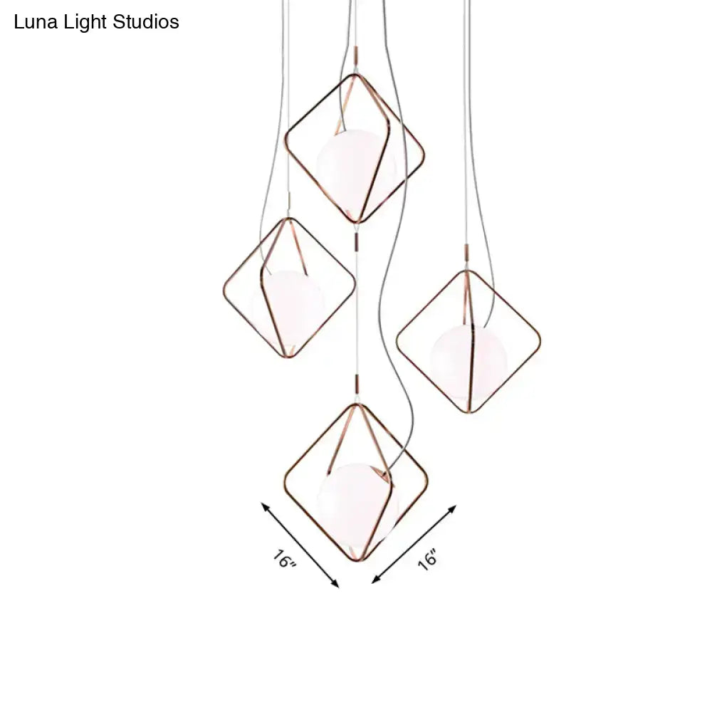 Decorbites copper square pendant lights; copper-wire frames with white bulbs on clear cords on Tampa Home & Garden Store