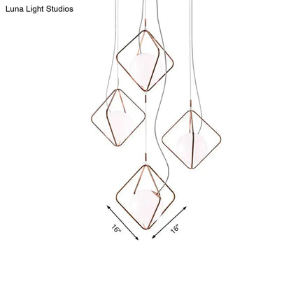 Decorbites copper square pendant lights; copper-wire frames with white bulbs on clear cords on Tampa Home & Garden Store