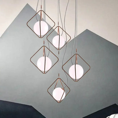 Five copper square suspension light pendants with frosted white globes by Decorbites on Tampa Home & Garden Store