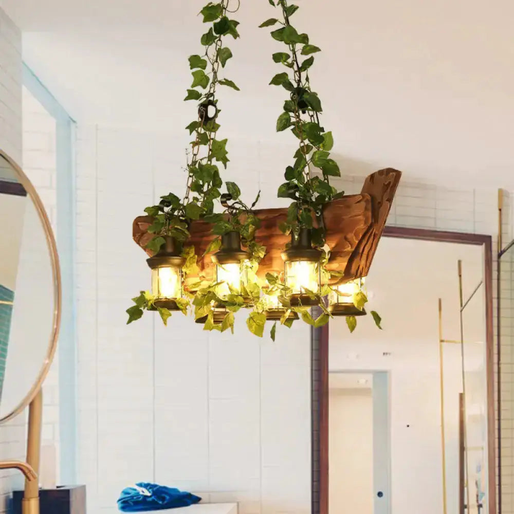 Industrial ivy pendant light with four lantern bulbs wrapped in green vines on Tampa Home & Garden Store