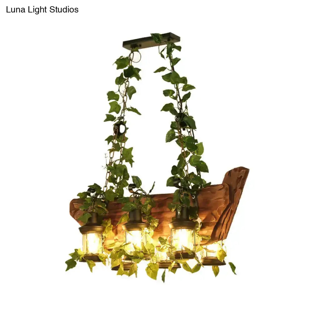 Industrial ivy pendant light with four lantern pendants wrapped in green vines on Tampa Home & Garden Store