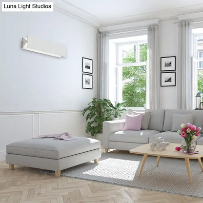 White Linear LED Sconce wall-mounted, minimalist Decorbites fixture in a bright living room on Tampa Home & Garden Store
