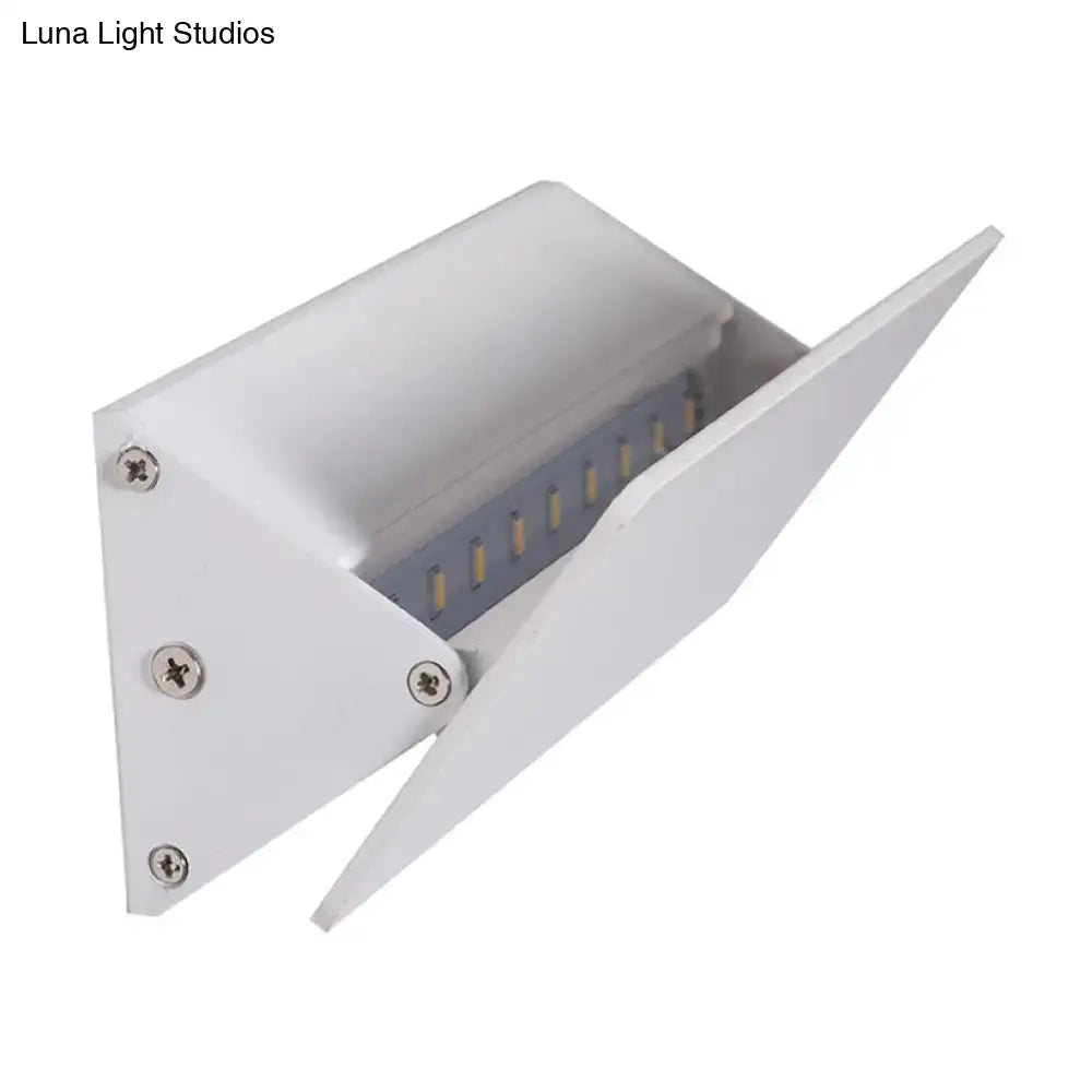 White linear LED sconce by Decorbites with angled metal faceplate and exposed LEDs on Tampa Home & Garden Store