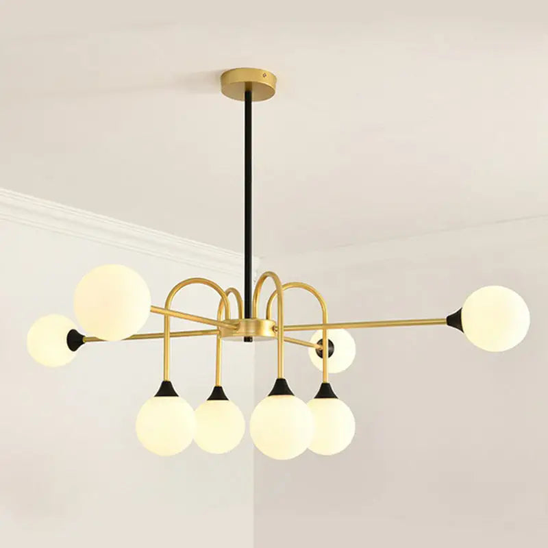 Gold brass chandelier with white glass globes by Decorbites on Tampa Home & Garden Store