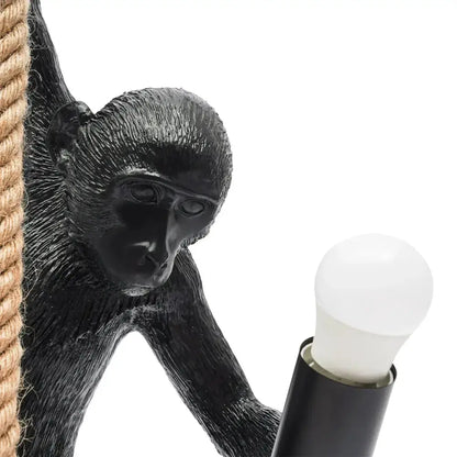 Black monkey pendant light with hemp rope accent and exposed bulb on Tampa Home & Garden Store