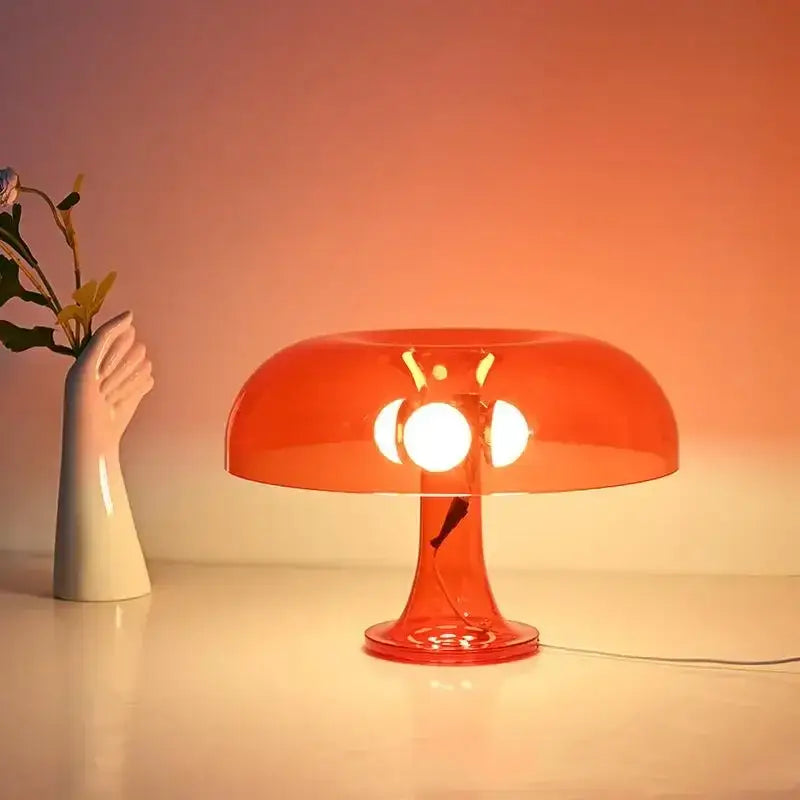 Black LED Mushroom Lamp Decorbites bedside table lamp in orange glow with white vase nearby on Tampa Home & Garden Store