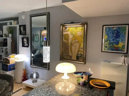 White mushroom LED table lamp on granite kitchen island with warm glow on Tampa Home & Garden Store
