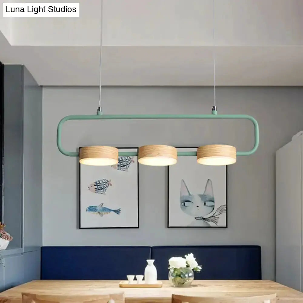 Modern mint green hanging pendant light with wood accents for kitchen island by Decorbites on Tampa Home & Garden Store