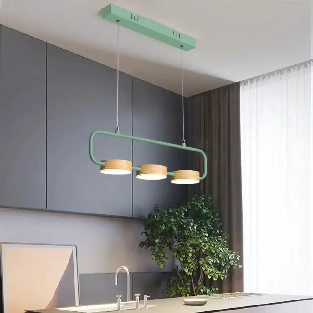 Mint green 3-light pendant with wood accents for kitchen island on Tampa Home & Garden Store