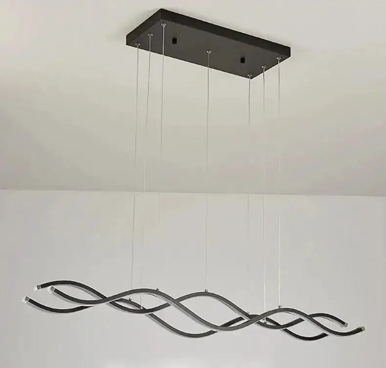 Chandelier Decorbites curved LED pendant light with black wave frame suspended from plate on Tampa Home & Garden Store