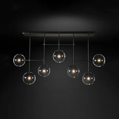 Black Gold Sphere Light with six clear glass globes hanging from a black metal frame on Tampa Home & Garden Store