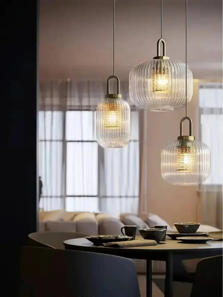 Three vintage brass ribbed glass pendant lights with brass caps on Tampa Home & Garden Store