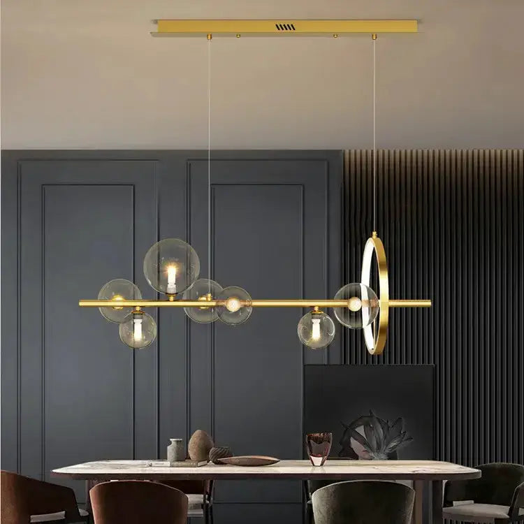 Decorbites modern chandelier with gold bar and clear glass bubble globes for dining room on Tampa Home & Garden Store