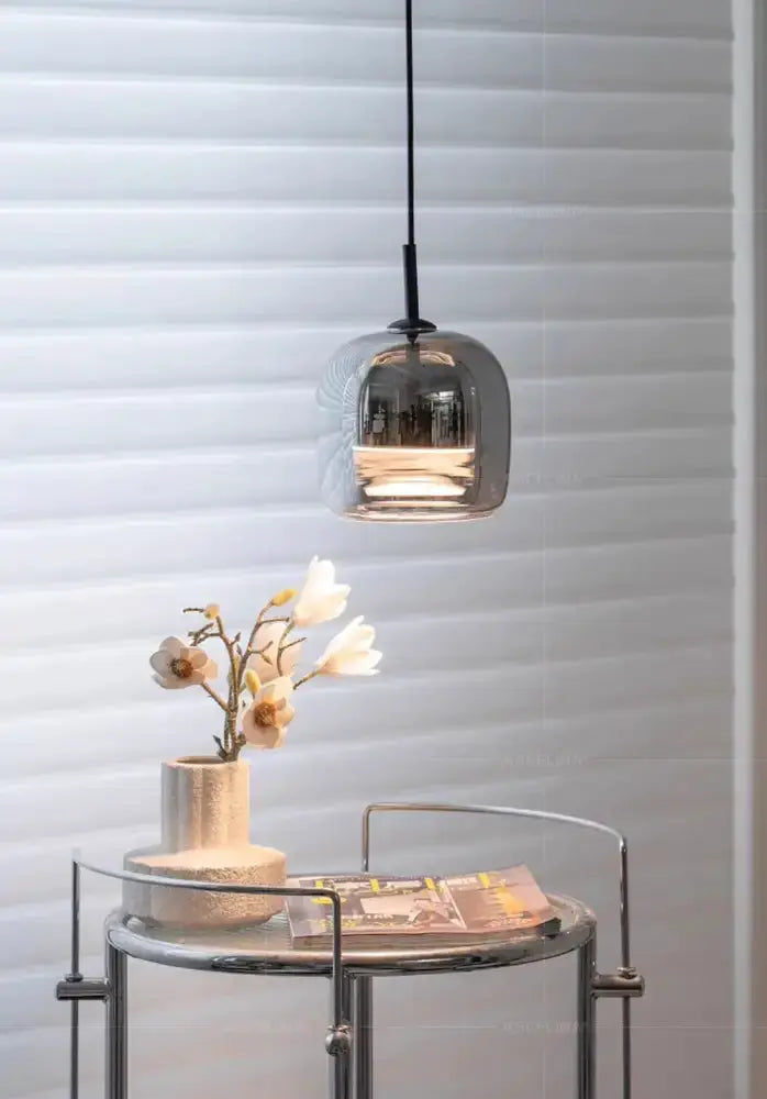 Modern glossy black Nordic glass LED pendant light by Decorbites hanging from black cord on Tampa Home & Garden Store